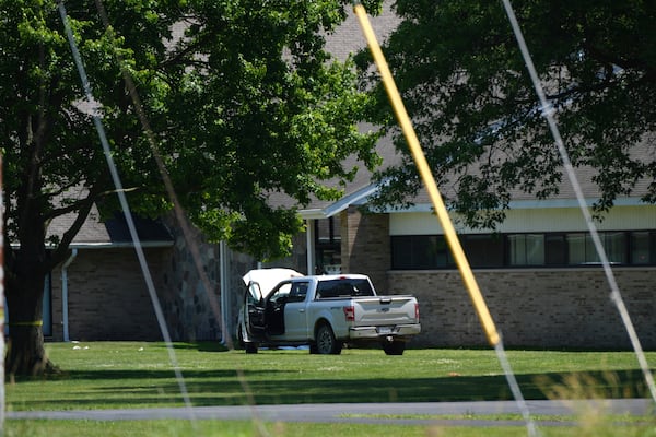 An idle vehicle sits near CrossPointe Community Church in Wayne, Mich., Sunday, June 23, 2025. (AP Photo/Paul Sancya)