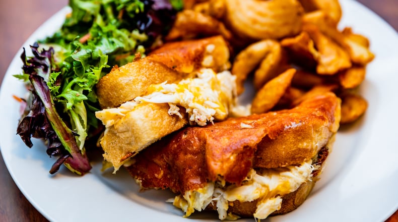 The crabmeat grilled cheese sandwich at Poor Calvin's is a study in decadence.