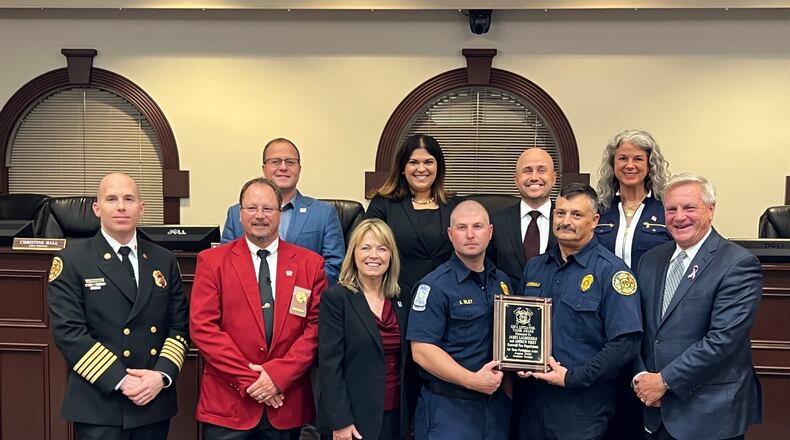 Roswell’s mayor, city council and Fire Chief Joe Pennino recently recognized firefighters Andrew Riley and James Laudermilk for receiving the 2023 Life Saving Valor Award by the Georgia State Firefighters Association. (Courtesy City of Roswell)