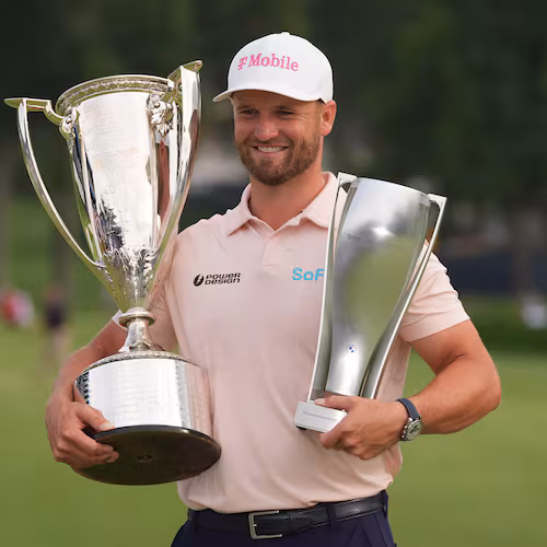 Wyndham Clark holds the Wanamaker Trophy and the BMW trohy after winning the BMW Championship golf tournament, Sunday, Aug. 23, 2026, in St. Louis. (AP Photo/Jeff Roberson)