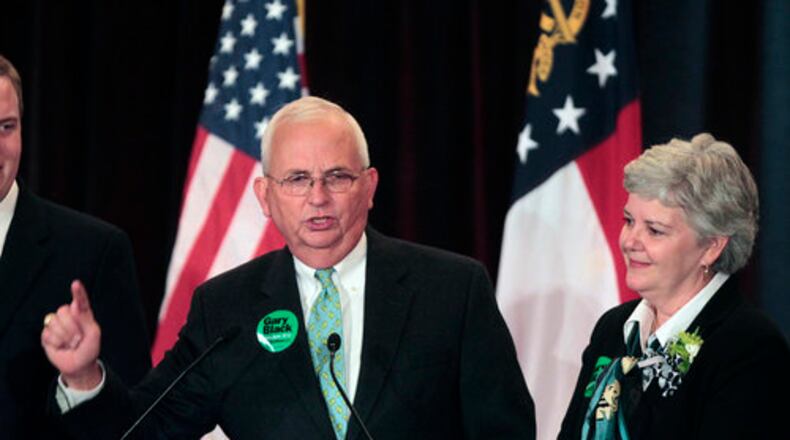 Republican nominee for Georgia Agriculture Commissioner Gary Black speaks as his wife Lydia looks during an election-night party on Tuesday, Nov. 2, 2010 in Atlanta.