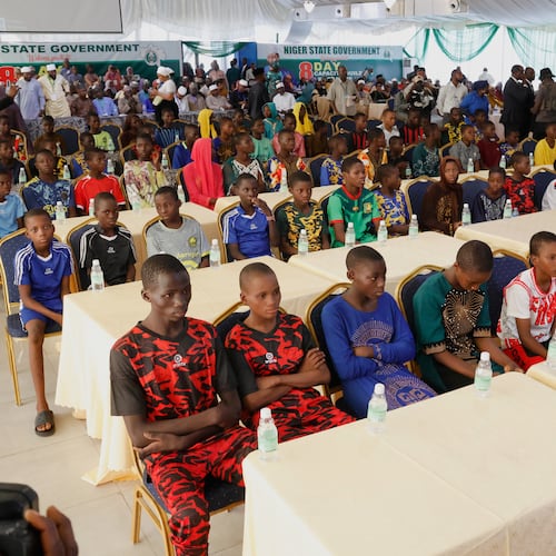 Freed students of the St. Mary's Catholic School in the Papiri community upon arrival at the government house in Minna, Nigeria, Monday, Dec. 8, 2025. (AP Photo)