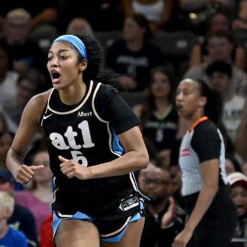Dream forward Angel Reese reacts after scoring against the Wings on Friday, May 22, 2026, at Gateway Center Arena in Atlanta. Reese had 15 points and nine rebounds. (Hyosub Shin/AJC)
