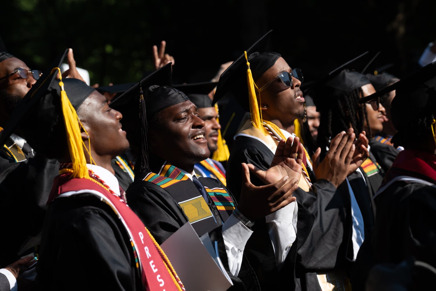 Graduates applaud during the Morehouse College graduation Sunday, May 17, 2026. (Ben Gray for the AJC)