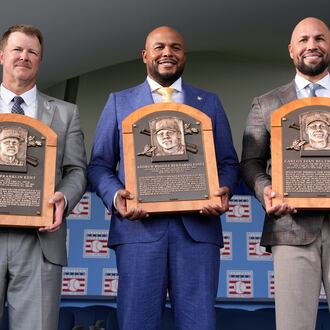 The 2026 Baseball Hall of Fame inductees Jeff Kent, left, Andruw Jones, center, and Carlos Beltran pose for pictures after the induction ceremony in Cooperstown, N.Y., Sunday, July 26, 2026. (AP Photo/Seth Wenig)