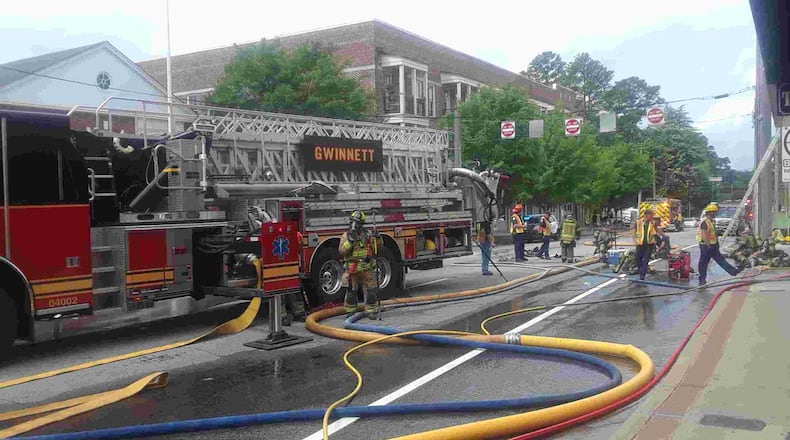 A fire damaged a downtown Lawrenceville gun shop Saturday morning, authorities said.