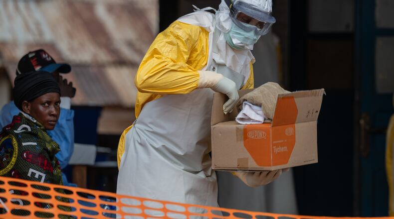 A health worker prepares for duty at the Mongbwalu treatment center in Mongbwalu, Congo, Friday, June 5, 2026. (AP Photo/Moses Sawasawa)