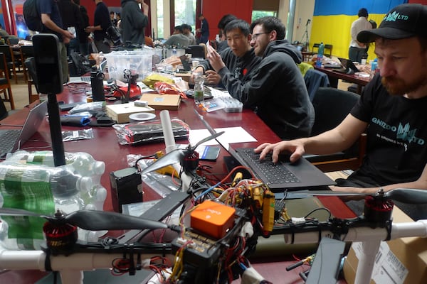 Participants gather for the London Defence Tech Hackathon, a weekend brainstorming solution for technical challenges, at the Royal Military Academy Sandhurst in Camberley, England, May 10, 2025. (AP Photos/Kelvin Chan)