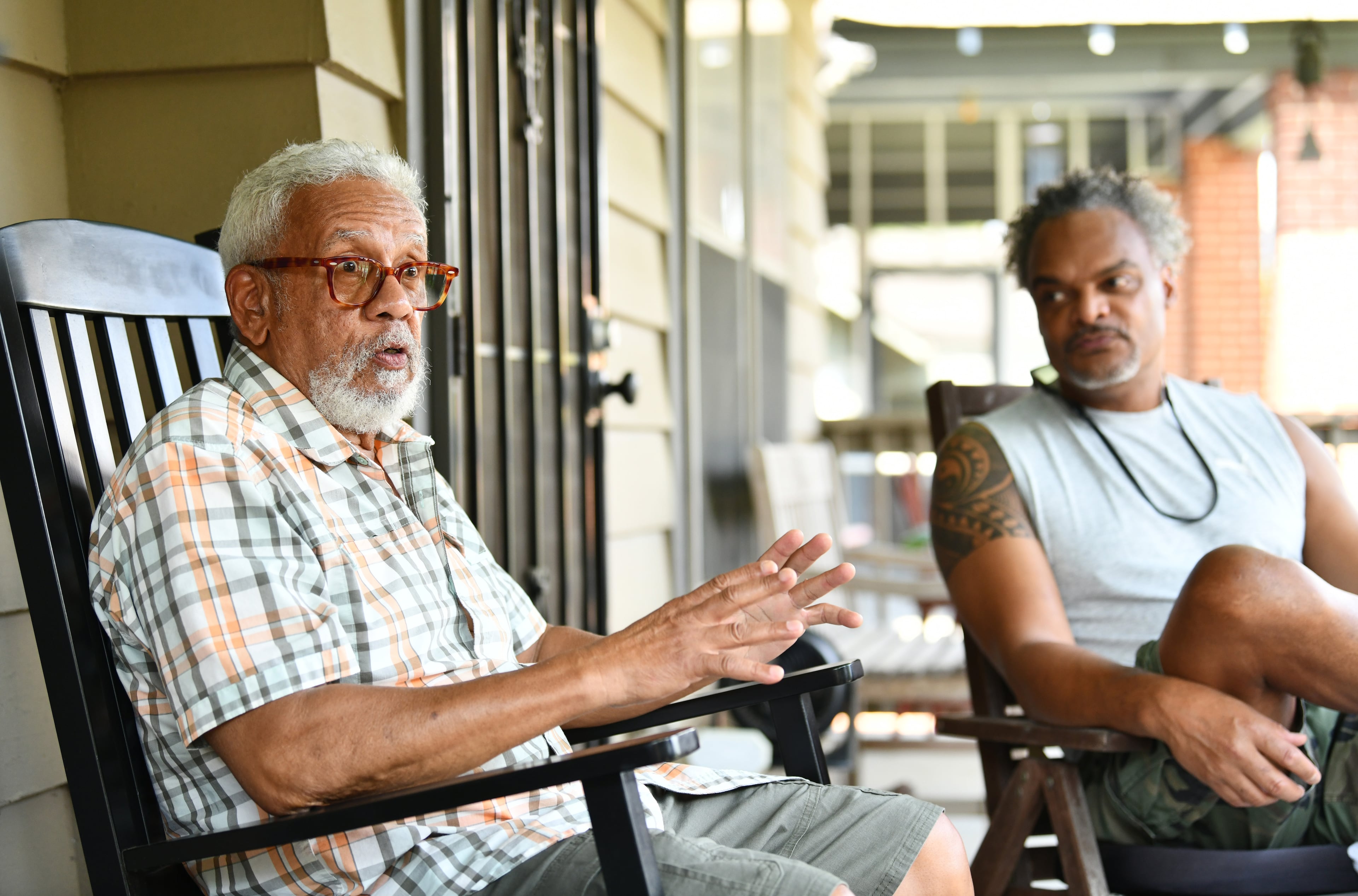 Albert B. Cooper IV (left), Forrest Coley and other longtime residents of Old Fourth Ward discuss the former Atlanta Medical Center. (Hyosub Shin/AJC)
