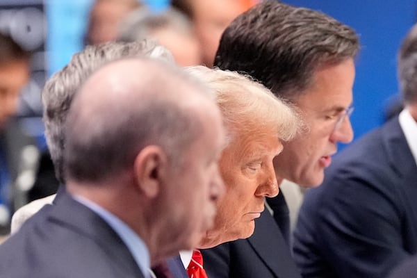 President Donald Trump listens to NATO Secretary General Mark Rutte, right, during a plenary session at the NATO summit in The Hague, Netherlands, Wednesday, June 25, 2025. (AP Photo/Alex Brandon)