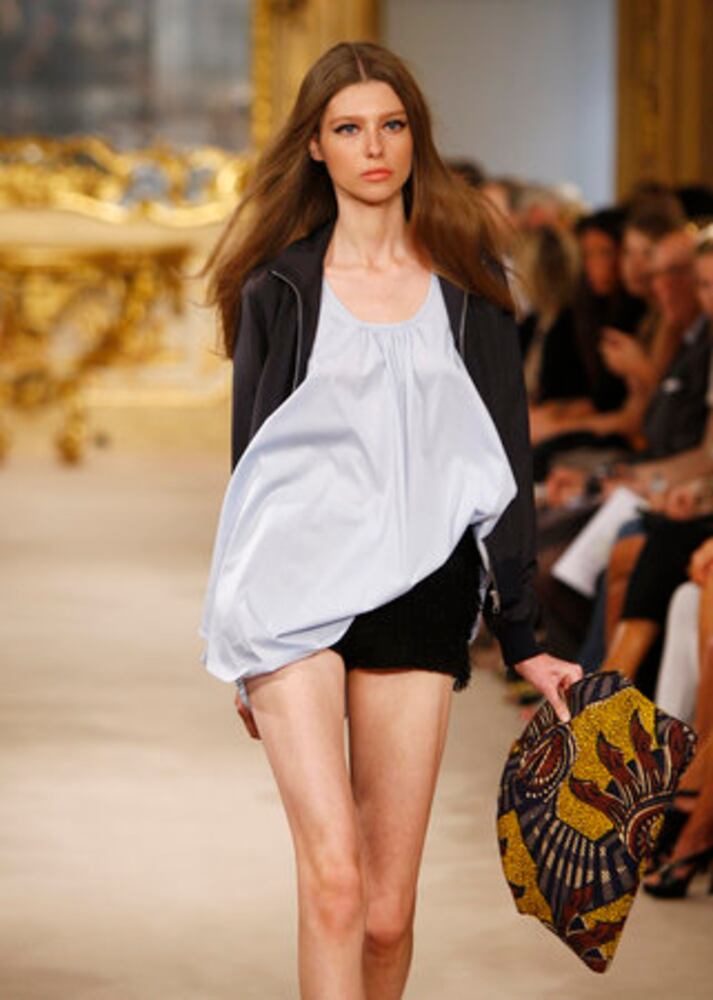 Models take the catwalk during Milan Fashion Week 2011