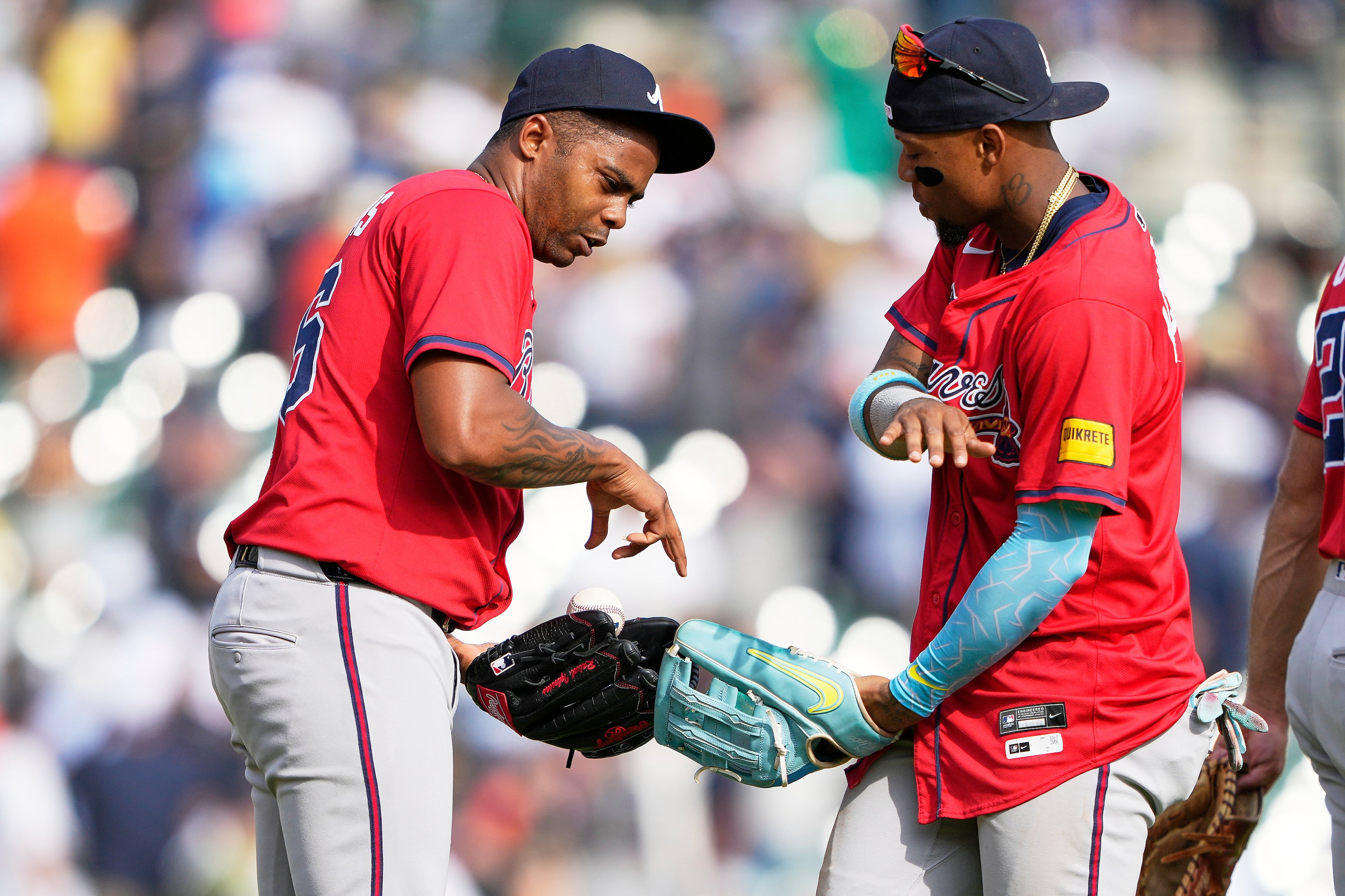Raisel Iglesias (left) and Ronald Acuña Jr. celebrate a recent win in Detroit.