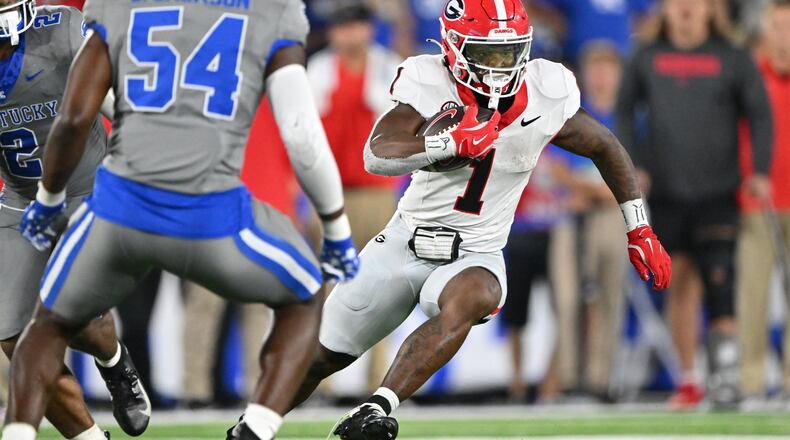 Georgia running back Trevor Etienne (1) runs with the ball during the second half in an NCAA football game at Kroger Field, Saturday, September 14, 2024, in Lexington, Kentucky. Georgia won 13-12 over Kentucky. (Hyosub Shin / AJC)