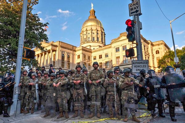 Police in riot gear control the area around the Georgia State Capitol in Atlanta during protests in May. Ben Gray for The Atlanta Journal-Constitution