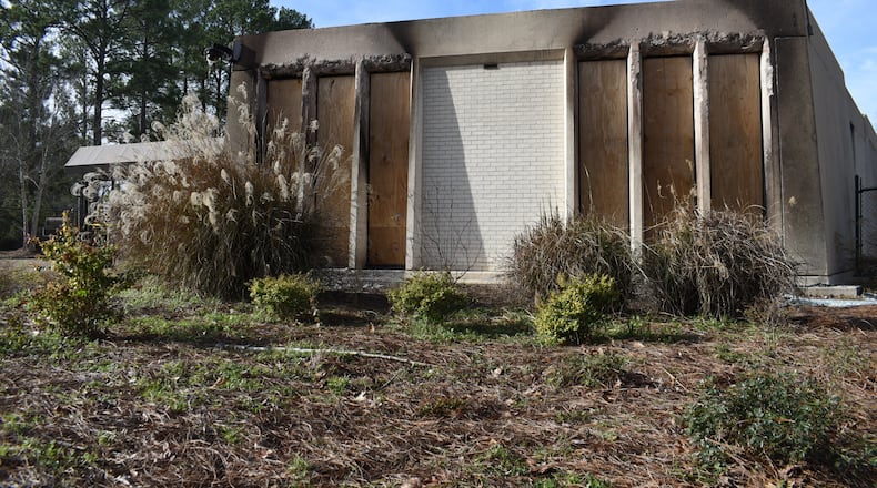 Boards cover the charred remains of the Beth Israel Congregation library, which was set on fire Jan. 10, 2026, in Jackson, Mississippi. A 19-year-old man who espoused antisemitic views was arrested. (Sophie Bates/AP)