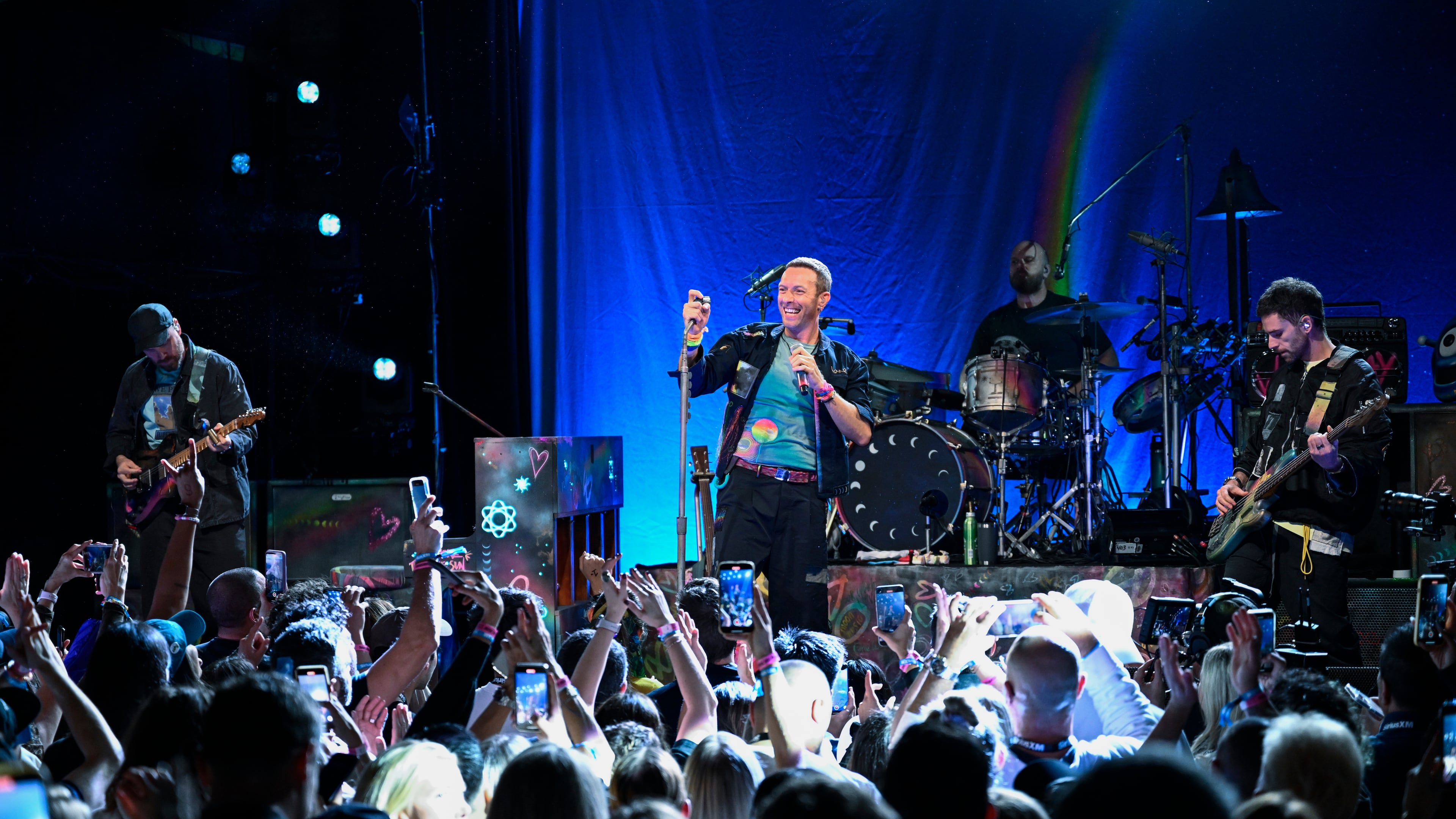 FILE - Jonny Buckland, from left, Chris Martin, Will Champion, and Guy Berryman of Coldplay performs a song from the band's 10th studio album "Moon Music" on Monday, Oct. 7, 2024, in the Williamsburg section of the Brooklyn borough of New York. (Photo by Evan Agostini/Invision/AP, file)