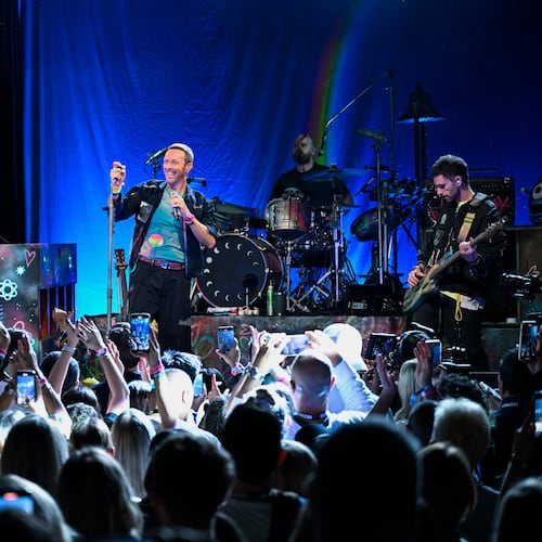 FILE - Jonny Buckland, from left, Chris Martin, Will Champion, and Guy Berryman of Coldplay performs a song from the band's 10th studio album "Moon Music" on Monday, Oct. 7, 2024, in the Williamsburg section of the Brooklyn borough of New York. (Photo by Evan Agostini/Invision/AP, file)