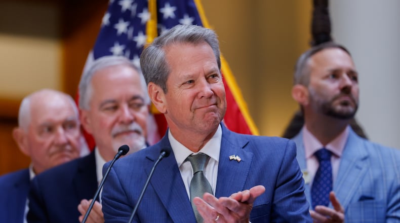 Georgia Gov. Brian Kemp — pictured before he signed a series of education bills at the Georgia Capitol on Tuesday, May 5, 2026 — notified the General Assembly that he intends to sign bills to cut the state income tax rate and to limit annual property tax assessment increases. (Arvin Temkar/AJC)