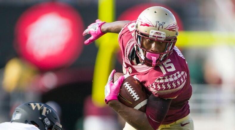 Florida State wide receiver Travis Rudolph sheds Wake Forest defender Jesse Bates III in the first half of an NCAA college football game in Tallahassee, Fla., Saturday, Oct. 15, 2016. (AP Photo/Mark Wallheiser)