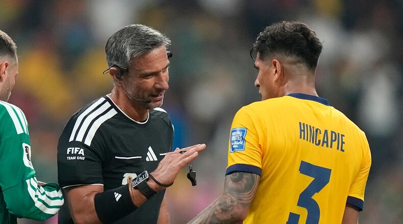 Referee Slavko Vincic, of Slovenia, talks to Ecuador's Piero Hincapie (3) during the World Cup round of 32 soccer match between Mexico and Ecuador in Mexico City, Tuesday, June 30, 2026. (AP Photo/Fernando Llano)