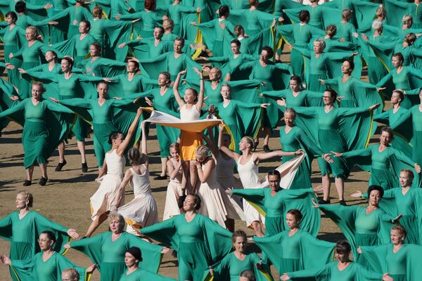 Participants perform during the Estonian Song and Dance Celebration "Iseoma" at the Kalev Stadium in Tallinn, Estonia, Friday, July 4, 2025. (AP Photo/Sergei Grits)