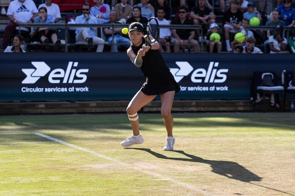 China's Xinyu Wang plays a return to Coco Gauff of the United States during the Berlin WTA tennis tournament in Berlin, Germany, Thursday, June 19, 2025. (Hannes P. Albert/dpa via AP)