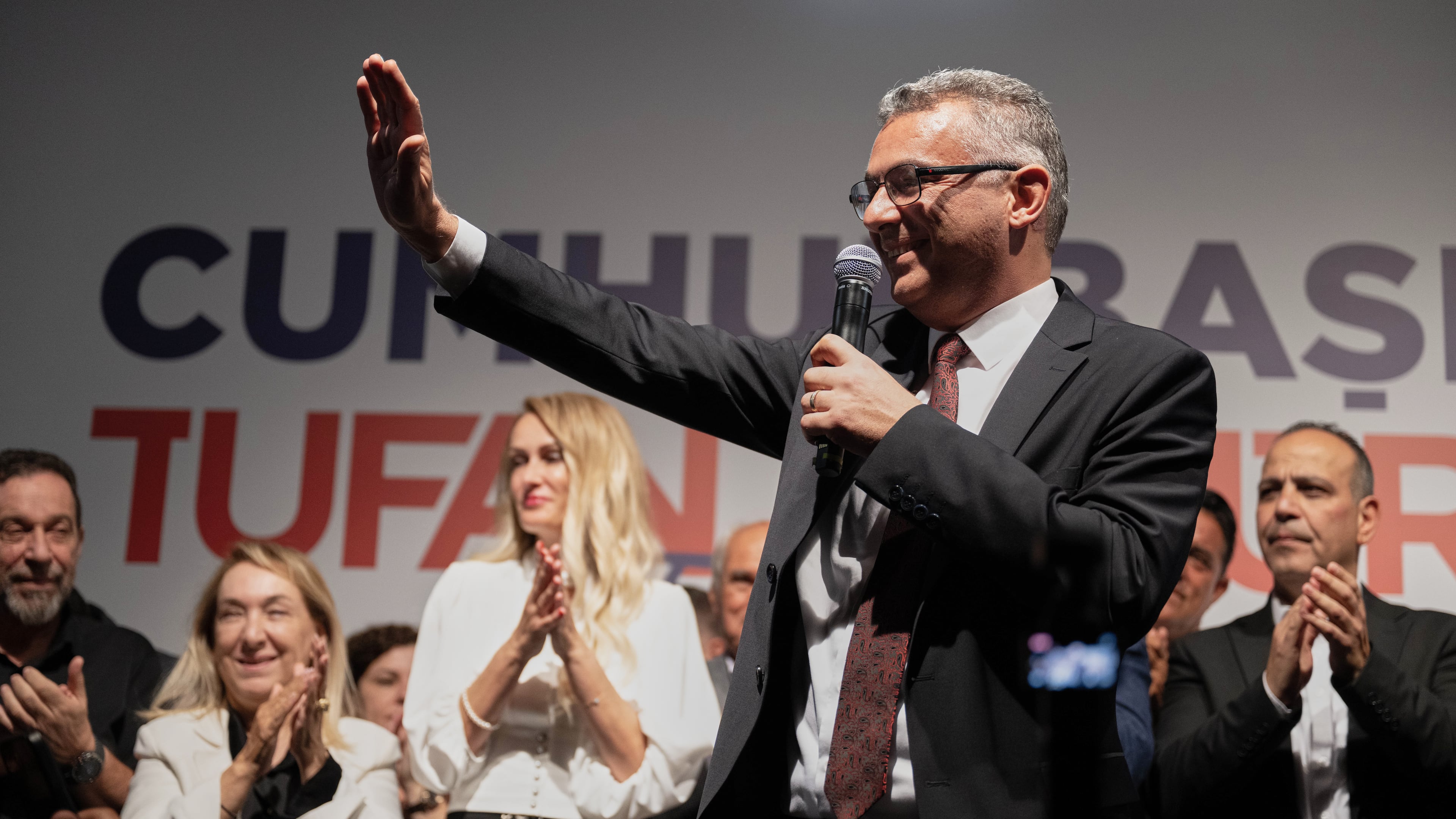 Turkish Cypriot newly elected leader Tufan Erhurman waves to supporters after winning the leadership election in the Turkish occupied northern part of the divided capital Nicosia, Cyprus, Sunday, Oct. 19, 2025. (AP Photo/Nedim Enginsoy)