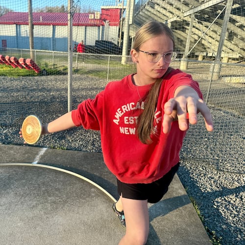 Becky Pepper-Jackson prepares to throw a discus Tuesday, April 7, 2026, at Bridgeport High School in Bridgeport, W.VA. (AP Photo/John Raby)