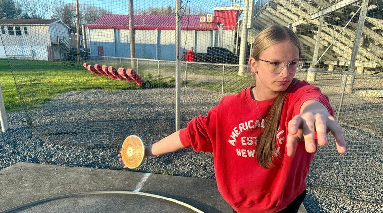 Becky Pepper-Jackson prepares to throw a discus Tuesday, April 7, 2026, at Bridgeport High School in Bridgeport, W.VA. (AP Photo/John Raby)