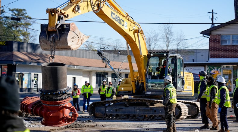 DeKalb County watershed crews work to fix a broken water main on Clairmont Road on Thursday, the third day of repair work. (Ben Hendren for The Atlanta Journal-Constitution)