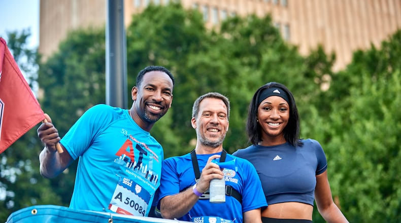 Maria Taylor (right) with Atlanta Mayor Andre Dickens (left) and Atlanta City Council President Doug Shipman. Photo by Paul McPherson