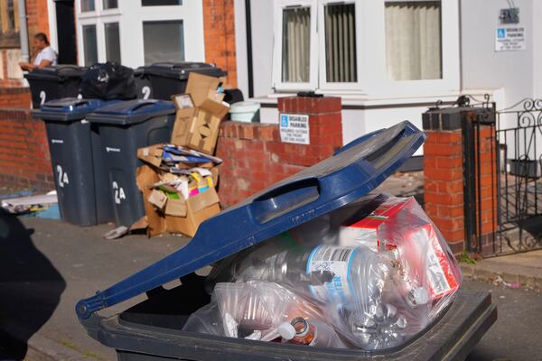 Rubbish piles up on a residential street in Birmingham, England, Monday, April 7, 2025, amid an ongoing refuse workers' strike in the city. (AP Photo/Kirsty Wigglesworth)