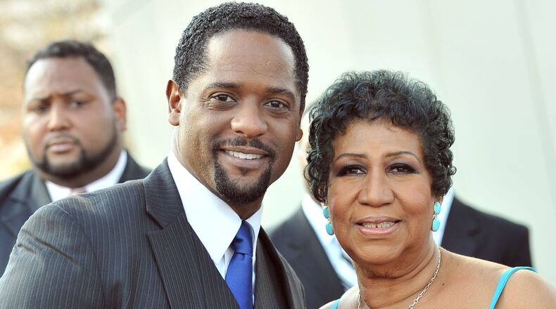 Aretha Franklin, posing with actor Blair Underwood, delighted everyone at the 2012 Trumpet Awards, held annually in Atlanta. AJC file photo: Hyosub Shin.