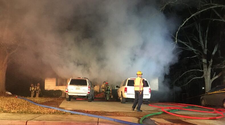 A home caught fire early Tuesday morning in Duluth, closing Dogwood Street.