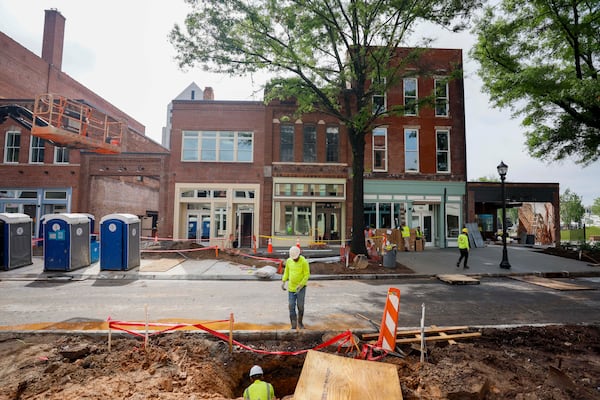 Construction workers are actively working on Broad Street as South Downtown undergoes revitalization. This area features the city’s largest collection of historic real estate assets and is located in the heart of the city, as seen on Wednesday, May 27, 2026. The South Downtown portfolio is owned by David Cummings and Jon Birdsong, founders of Atlanta Ventures, who also run Atlanta Tech Village in Buckhead. (Miguel Martinez/AJC)