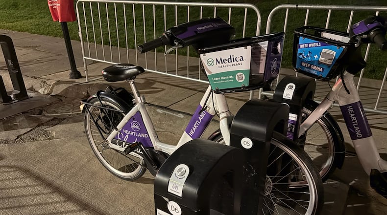 Omaha's Heartland Bike Share program places 400 e-bikes, such as this one, across the metropolitan area for public use. It is free for residents of metropolitan Omaha and a small charge for out-of-town sports columnists. (Ken Sugiura/AJC)
