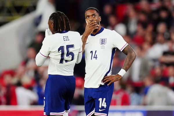 England's Ivan Toney (14) and England's Eberechi Eze react after Senegal's Cheikh Sabaly scores their side's third goal of the game during an international friendly match against Senegal at The City Ground in Nottingham, England, Tuesday, June 10, 2025. (Mike Egerton/PA via AP)