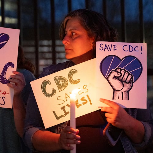 People gather for a candlelight vigil in support of the Centers for Disease Control and Prevention in front of its headquarters in Atlanta, Friday, March 28, 2025. (Ben Gray/AP)