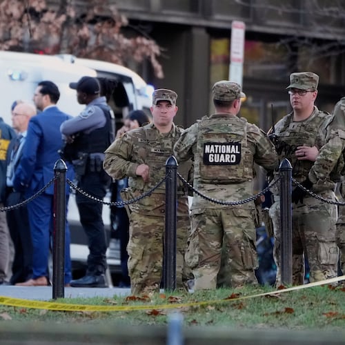 Emergency personnel gather in a cordoned off area where National Guard soldiers were shot near the White House Wednesday, Nov. 26, 2025, in Washington. (AP Photo/Mark Schiefelbein)