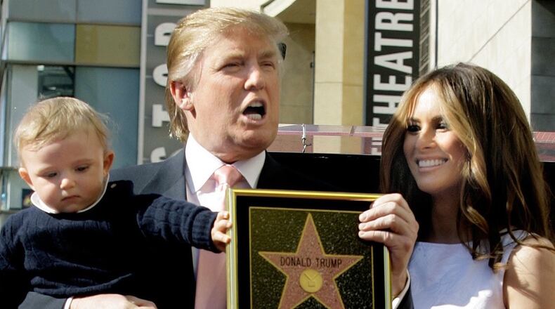 Donald Trump poses with son Barron and wife Melania at his Hollywood Walk of Fame ceremony in 2007. IMAGE: DAMIAN DOVARGANES/ASSOCIATED PRESS