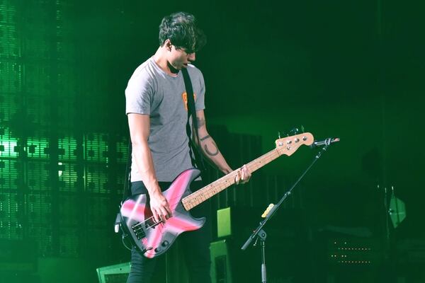 Calum Hood rocks some bass. Photo: Kate Teegardin/Special to the AJC.