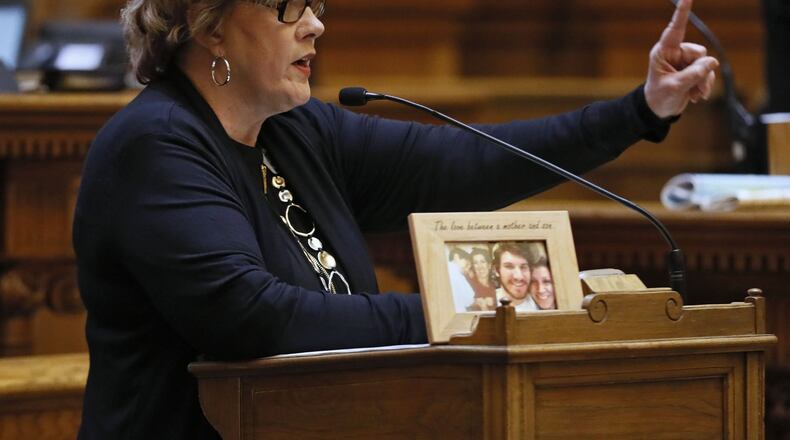 With a photo of an unidentified opioid victim on the lectern, state Sen. Renee Unterman, R-Buford, presents Senate Bill 352, one of two omnibus bills the Senate passed Wednesday that aim to gain control over the opioid crisis in Georgia. She was making a point that children can die after trying the drug even one time. BOB ANDRES /BANDRES@AJC.COM