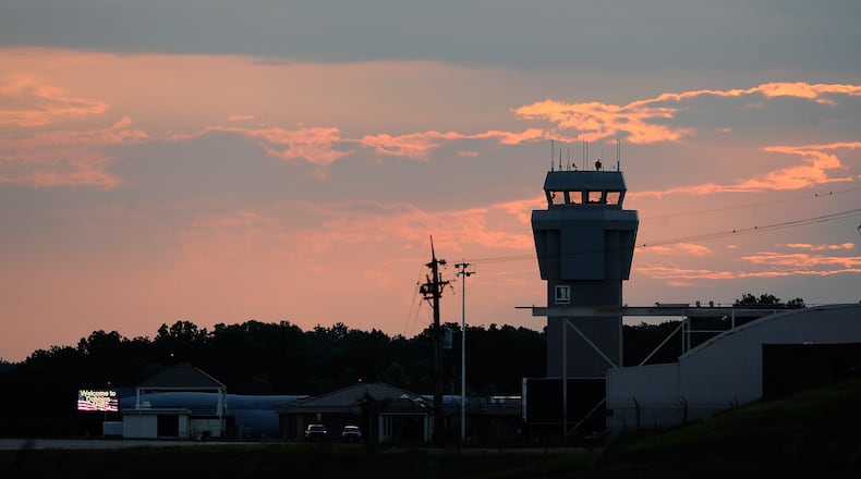 The sun sets behind the control tower at Dobbins Air Reserve Base on Aug. 1, 2014, in Marietta, Ga. David Tulis / AJC Special