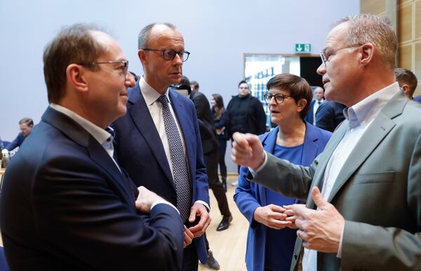 From left, Parliamentary Group Leader of the Bavarian conservative Christian Social Union (CSU) party Alexander Dobrindt, leader of Germany's Christian Democratic Union (CDU) Friedrich Merz and the co-leader of the Social Democratic Party (SPD) Saskia Esken prior to coalition talks between SPD CDU/CSU at the SPD headquarters in Berlin, Friday March 28, 2025. (Odd Andersen/Pool via AP)