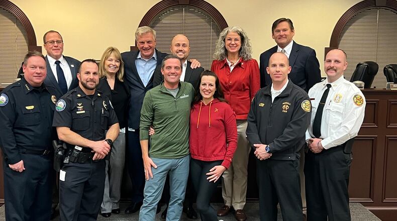 The owners of Orangetheory Fitness Roswell, 625 W. Crossville Road, recently donated 10 treadmills to the Roswell police and fire departments. COURTESY CITY OF ROSWELL