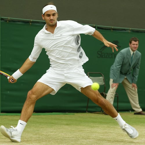 FILE - Switzerland's Roger Federer plays a return to Sjeng Schalken, of the Netherlands, during their men's singles quarter final match at the All England Lawn Tennis Championships at Wimbledon, July 3, 2003. (AP Photo/Alastair Grant, File)