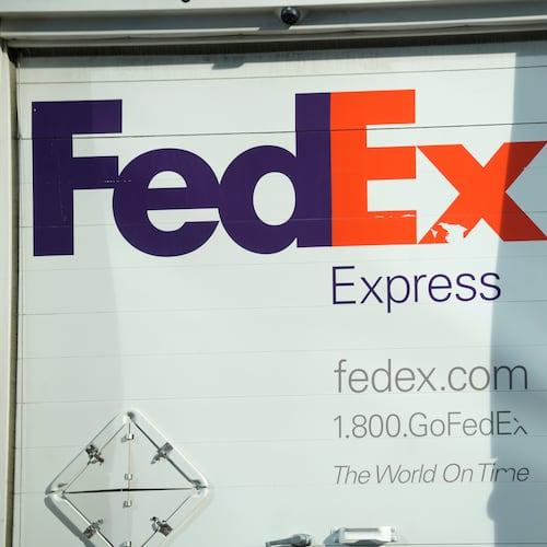 FILE - The company logo is shown on a FedEx delivery van, Sept. 13, 2023, in downtown Denver. (AP Photo/David Zalubowski, File)