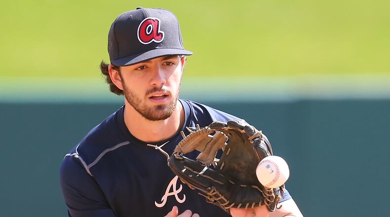 Braves top prospect infielder Dansby Swanson fields a grounder during spring training at Braves' camp in Lake Buena Vista, Fla. (Curtis Compton / ccompton@ajc.com)