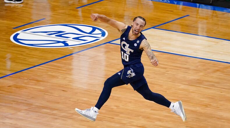 Georgia Tech guard Jose Alvarado (10) celebrates his team's 80-75 win over Florida State in the championship game of the ACC Tournament in Greensboro, N.C., Saturday, March 13, 2021. (AP Photo/Gerry Broome)