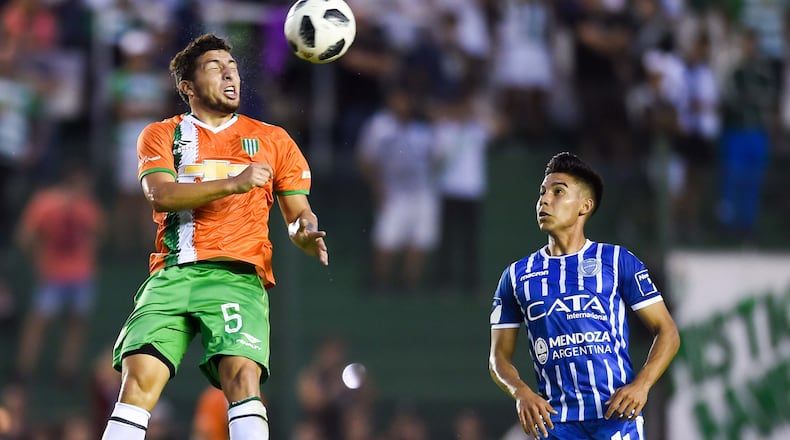 Eric Remedi of Banfield heads the ball against Guillermo Fernández of Godoy Cruz during a match between Banfield and Godoy Cruz as part of Argentina Superliga 2017/18 April 21, 2018, at Florencio Sola Stadium in Buenos Aires, Argentina.